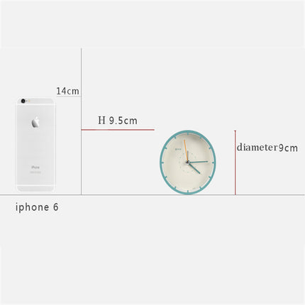 Minimalistické kulaté stolní hodiny bez číslic
