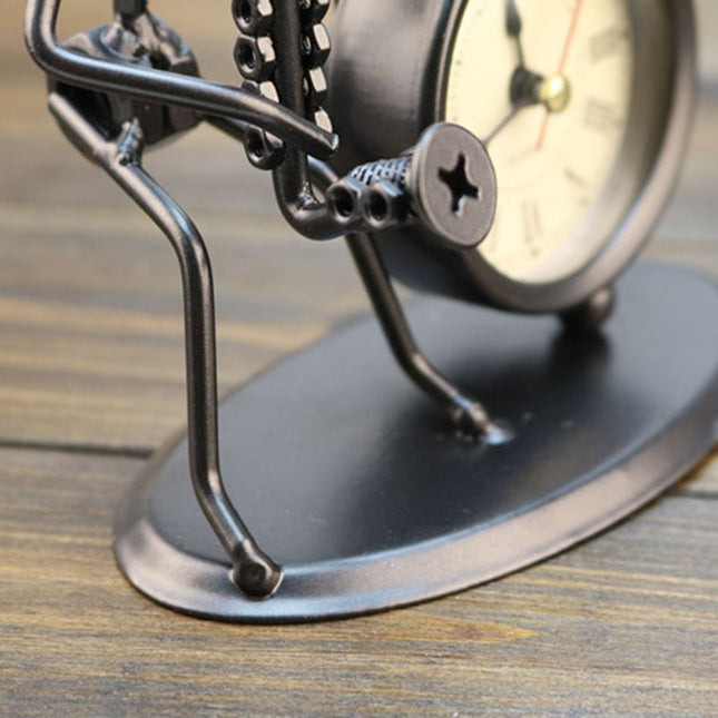 Kovové stolní hodiny s figurkou hudebníka