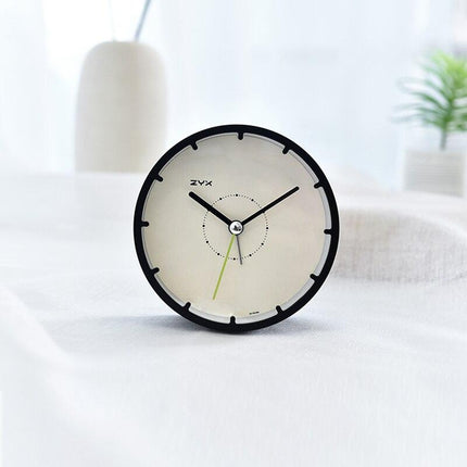 Minimalistické kulaté stolní hodiny bez číslic